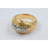 Continental unmarked yellow metal ring, the engraved head set with three diamonds, the centre