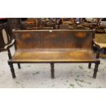 Late 19th / early 20th Century beechwood waiting room bench with a pierced bentwood seat on baluster