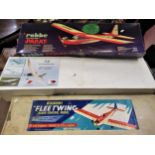 Three various unbuilt radio control model aircraft