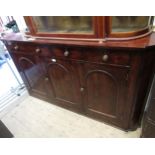 19th Century mahogany sideboard, the shallow figured top above four small frieze drawers and three