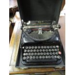 Cased Remington Victor typewriter some keys are pushed down but the rest are striking. Locking
