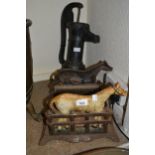 Cast iron horse motif boot scraper, a pair of hanging balance scales and a cast iron water pump