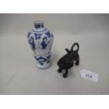 Miniature oriental patinated spelter figure of a temple dog, 3.25ins wide together with a small