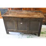 17th Century oak coffer, the hinged two plank lid above a three panel front, 47.5ins wide