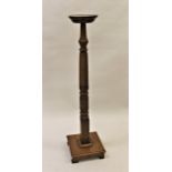 19th Century mahogany bed post torchere together with a similar hat and coat stand