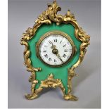 Small French gilt metal mantel clock, having circular enamel dial with Arabic and Roman numerals,