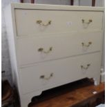 20th Century white painted chest of three long drawers on shaped bracket feet