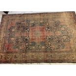 Tabriz carpet with a lobed medallion and all-over floral design on a midnight blue ground with