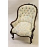 Victorian carved walnut and button upholstered drawing room chair with floral upholstery on cabriole