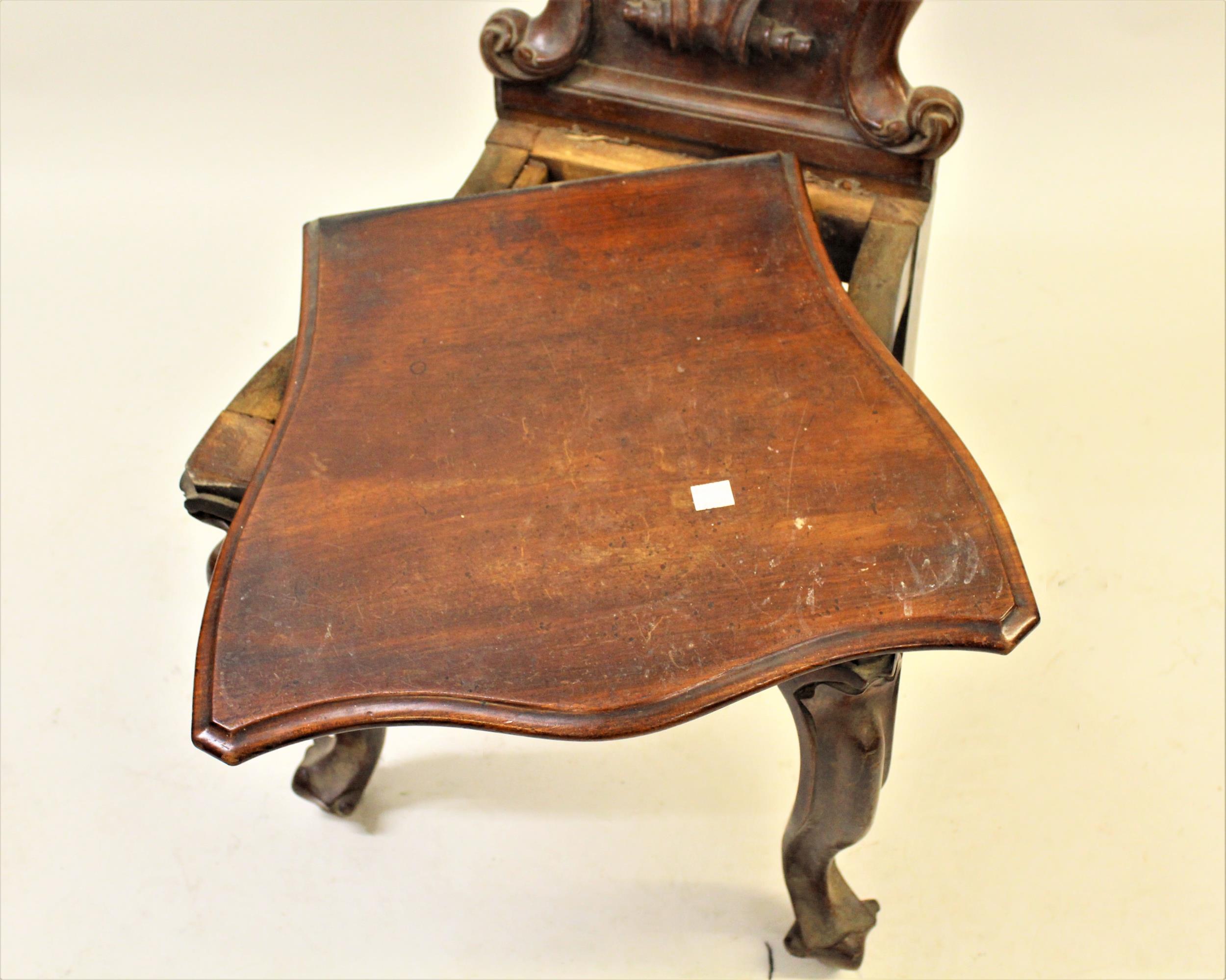 Victorian carved mahogany hall chair with a shaped back and panel seat on cabriole front supports - Image 2 of 2