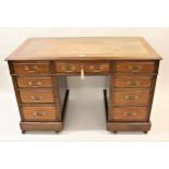 19th Century mahogany twin pedestal desk, having tan leather inset top above an arrangement of