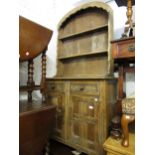 Small mid 20th Century oak dresser with a shelved back above two drawers and two panel doors on