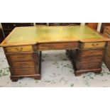 Reproduction mahogany inverted breakfront partner's desk, the green tooled leather inset top above