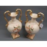 Pair of large late 19th Century pottery two handled pedestal vases with gilt handles, decorated with