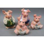 Group of four Wade Natwest pottery piggybanks