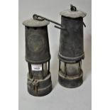 Two miner's brass safety lamps Crack to glass of the larger one, the other is in good condition.