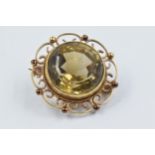 Circular 9ct gold mounted quartz brooch