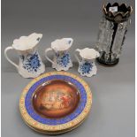 Victorian ruby glass lustre with prismatic drops, together with a set of three Vienna plates with