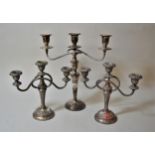 Pair of three branch silver plated candelabra together with a single three branch plated candelabra