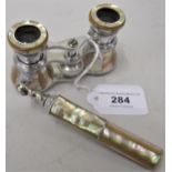 Pair of early 20th Century nickel plated and mother of pearl covered opera glasses by Dollond,