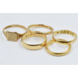 22ct Gold wedding band, 2.7g, three 18ct gold wedding bands, 7.3g and 9ct gold signet ring, 1g