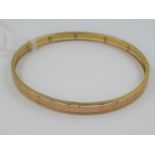 9ct Yellow gold bangle, 9.5g Generally in very good condition. Perhaps very slightly oval rather