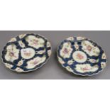 Pair of 18th Century Worcester dishes on blue and white ground, with hand painted floral