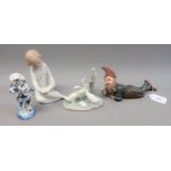 Small Continental painted terracotta figure of a gnome, Nao figure of a child reading, Nao group