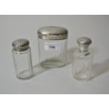 Set of three London silver cut glass dressing table bottles