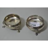 Pair of early 19th Century London silver circular salts on low hoof supports
