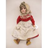 Early 20th Century bisque headed doll with sleeping eyes, open mouth and four teeth on a jointed