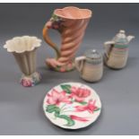 Clarice Cliff cornucopia jug vase with relief floral decoration on a pink ground, 10ins high,