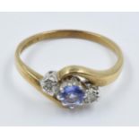 9ct Yellow gold tanzanite and two stone diamond set ring