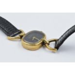 Roy King ladies 9ct gold cased wristwatch with a black leather strap, gross weight 15.5gms