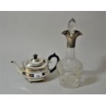 London silver Goldsmiths & Silversmiths Co. teapot with ebonised handle on low bun supports, 14.5ozs