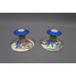 Pair of Clarice Cliff Bizarre Fantasque dwarf candlesticks painted in the Rudyard pattern, 3ins