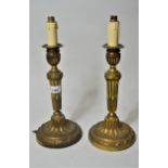 Pair of gilt brass candlesticks adapted for use as table lamps in 18th Century French style, 11ins