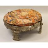 Antique Eastern circular carved hardwood stool with Indian fabric patchwork cushion, 30ins diameter