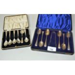 Cased set of silver coffee spoons with tongs together with another cased set of six silver coffee