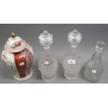 Pair of cut glass decanters with stoppers, together with another cut glass decanter with stopper and