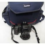 Nikon F601 SLR camera with travel case