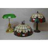 Brass desk lamp with green glass shade together with a Tiffany style hanging lampshade and a similar