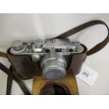 Leica IIIb 35mm camera with a Leitz Summar 5cm lens, in original brown leather case
