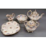 19th Century Staffordshire tea service with painted floral decoration comprising: teapot, sucrier,