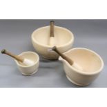Royal Doulton stoneware pestle and mortar, together with two others