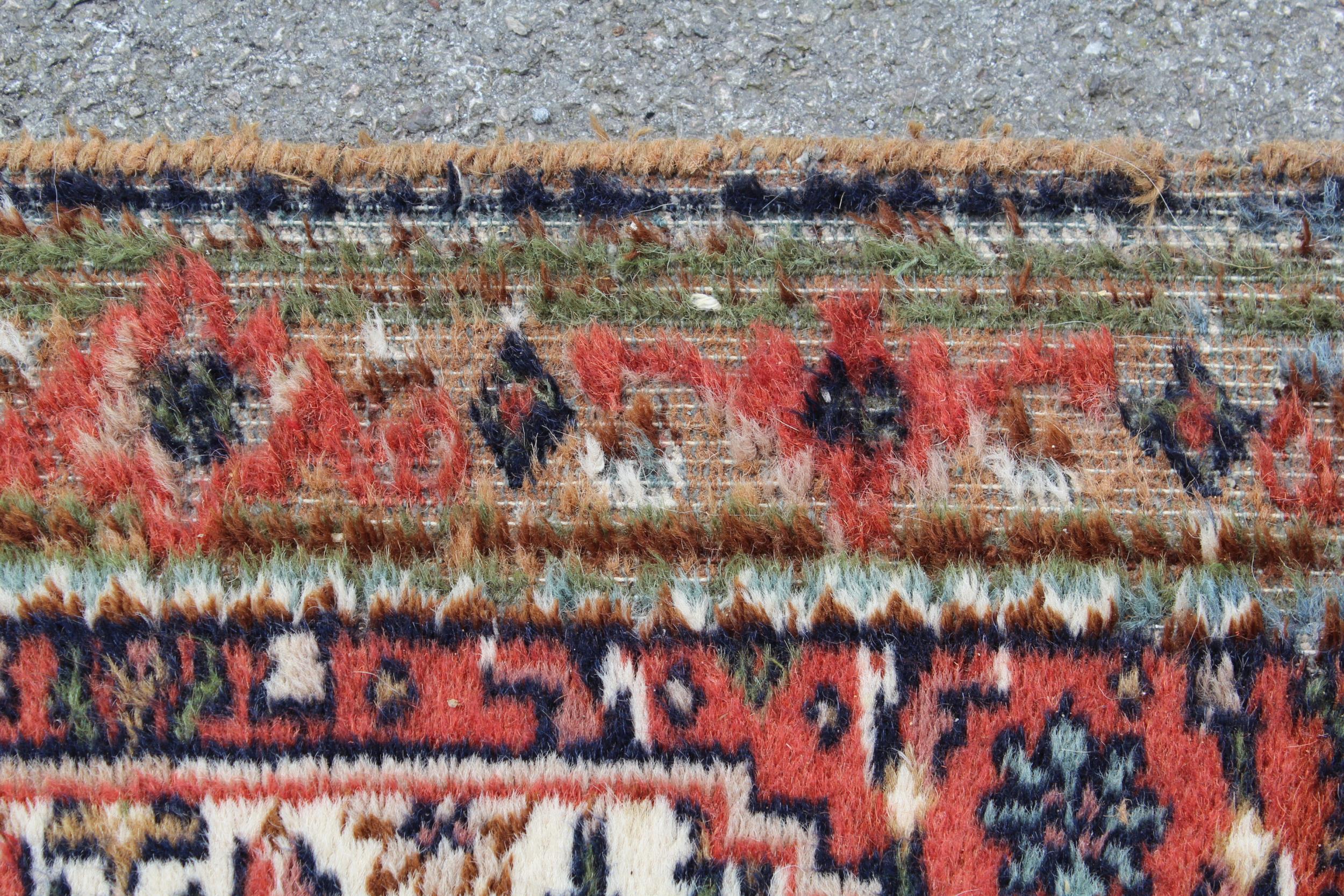 Indo Persian runner of Afghan design with a repeating hooked medallion pattern, on a rose ground - Image 6 of 6