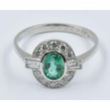 Art Deco style platinum, emerald and diamond oval cluster ring This is a modern ring in 'as new'