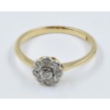 18ct Yellow gold nine stone diamond flowerhead ring Good general condition with slight signs of