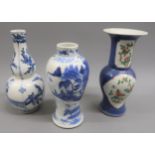 Small Chinese porcelain gourd shaped vase painted with figures and flowering trees in blue and