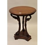 Late 20th Century circular mahogany lamp table, raised on three carved swan head supports with